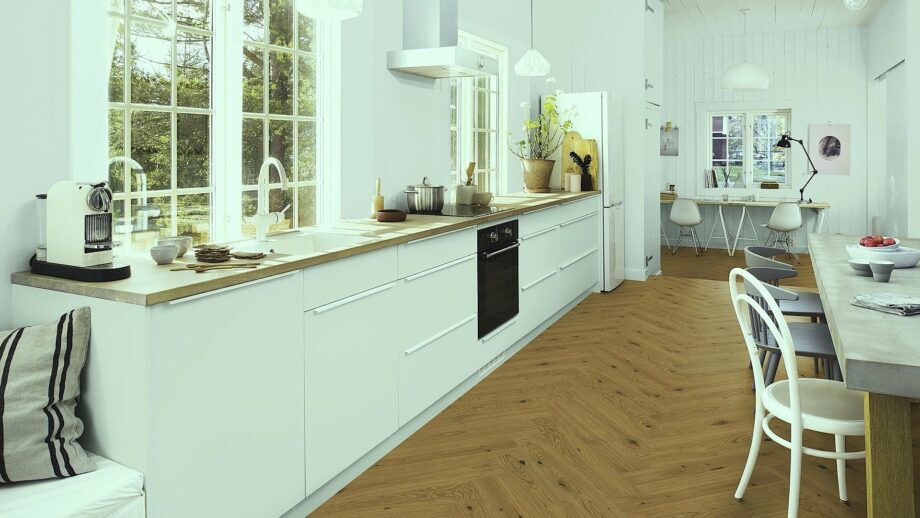 Herringbone flooring Oak Rustic 4-sided beveled brushed 2 coats of Osmo oil wax, installed on the kitchen floor, with kitchen furniture, dining table, and chairs